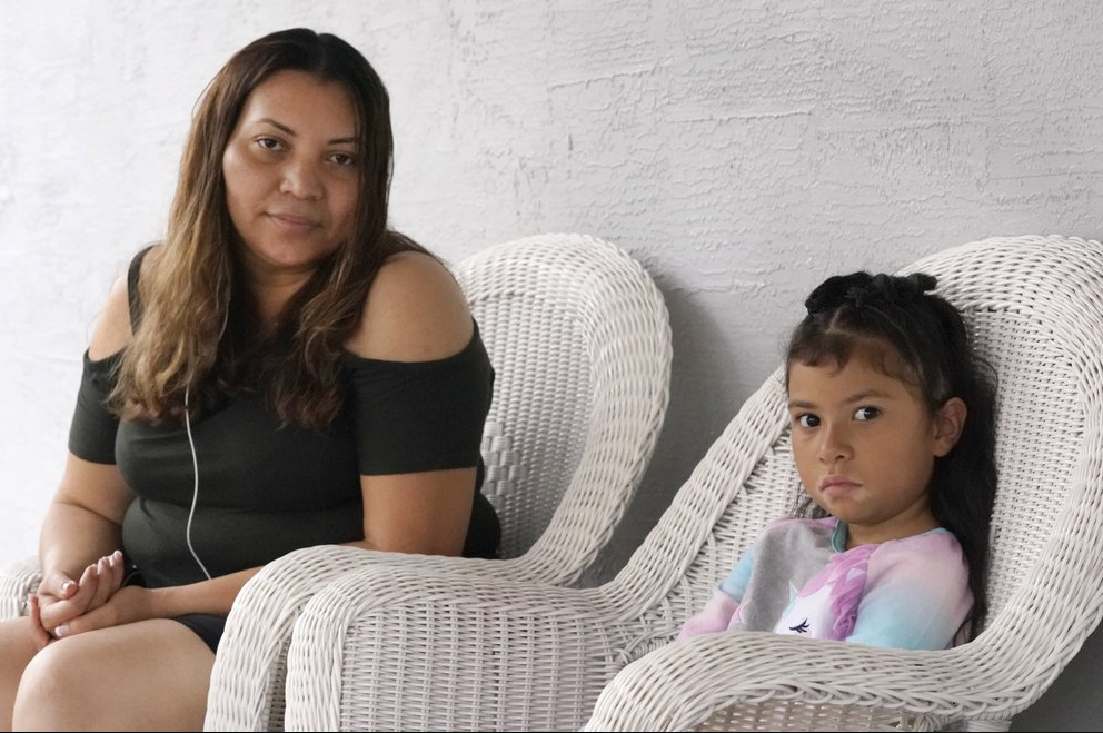Temporary Protected Status (TPS) holder Lili Montalvan, left, of El Salvador, poses for a photo with her daughter Roxana Gozzer, 6, Sunday, Oct. 25, 2020, at their home in Fort Lauderdale, Fla. - [Photo/AP Photo/Wilfredo Lee]