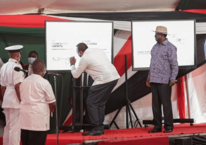 President Uhuru Kenyatta signing the BBI report at KICC on November 22, 2020. - [Photo/Courtesy]
