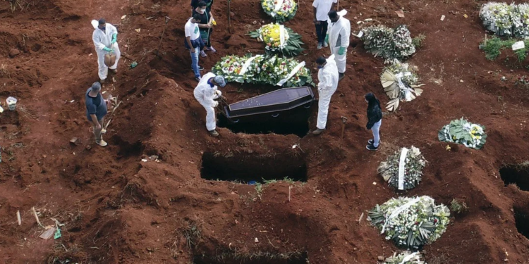AP | Cemetery workers in Brazil bury a victim of Covid-19, which has now claimed 3 million lives around the world.