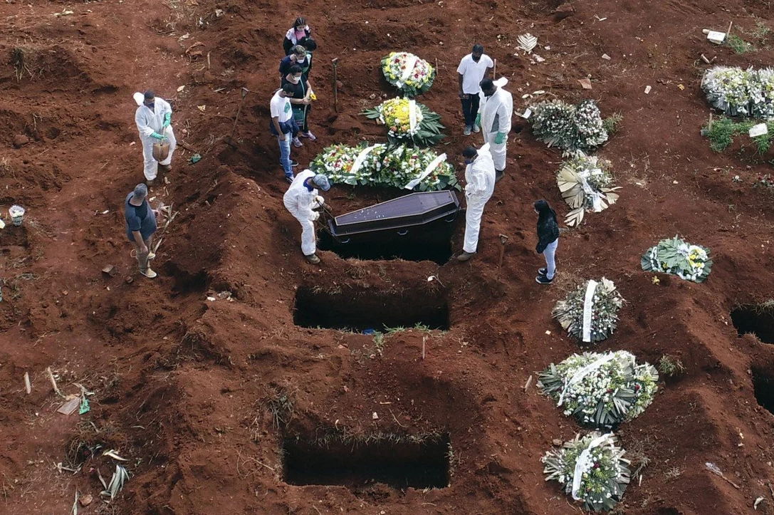 AP | Cemetery workers in Brazil bury a victim of Covid-19, which has now claimed 3 million lives around the world.