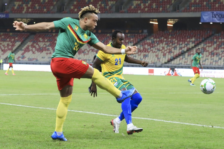 AFP - 
Olivier Miyonzima (R) of Rwanda cannot prevent Pierre Kunde (L) of Cameroon shooting during an Africa Cup of Nations qualifier in Douala on Tuesday.
