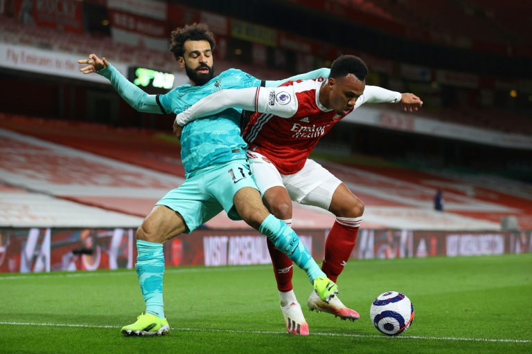 AFP | Liverpool forward Mohamed Salah (L) tussles with Arsenal defender Gabriel at the Emirates.