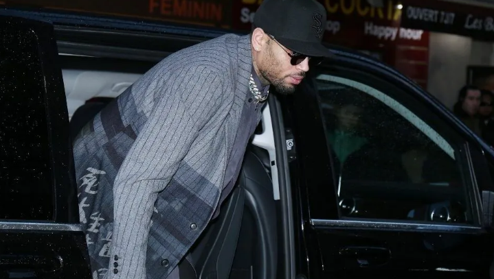 Chris Brown exiting a Car | Photo Courtesy