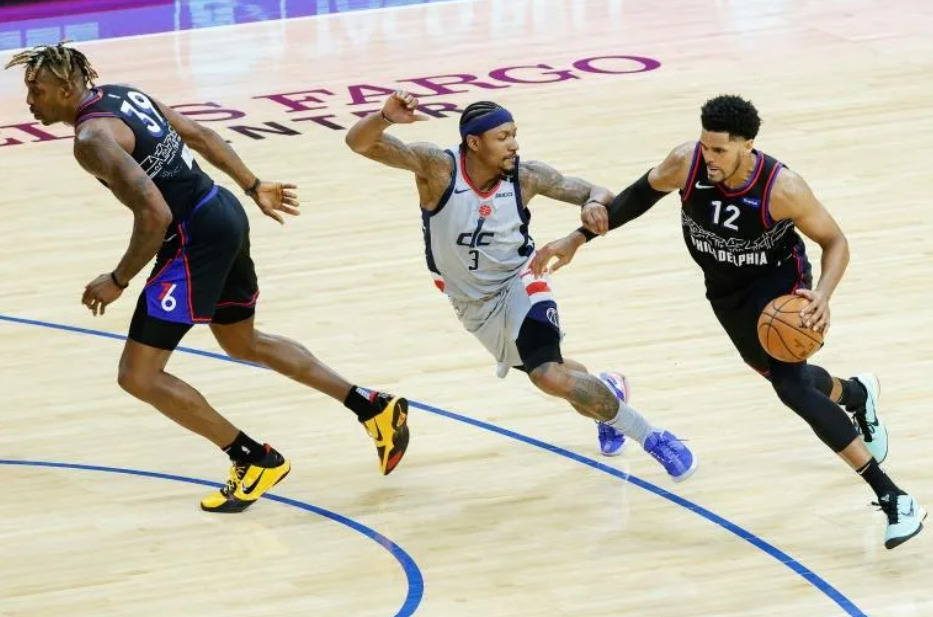 Philadelphia's Tobias Harris drives past Washington's Bradley Beal in their Eastern Conference playoff series opener | AFP