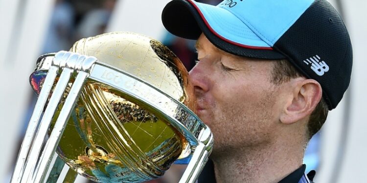 England captain Eoin Morgan kisses the World Cup trophy after his side's triumph at Lord's in 2019 | AFP