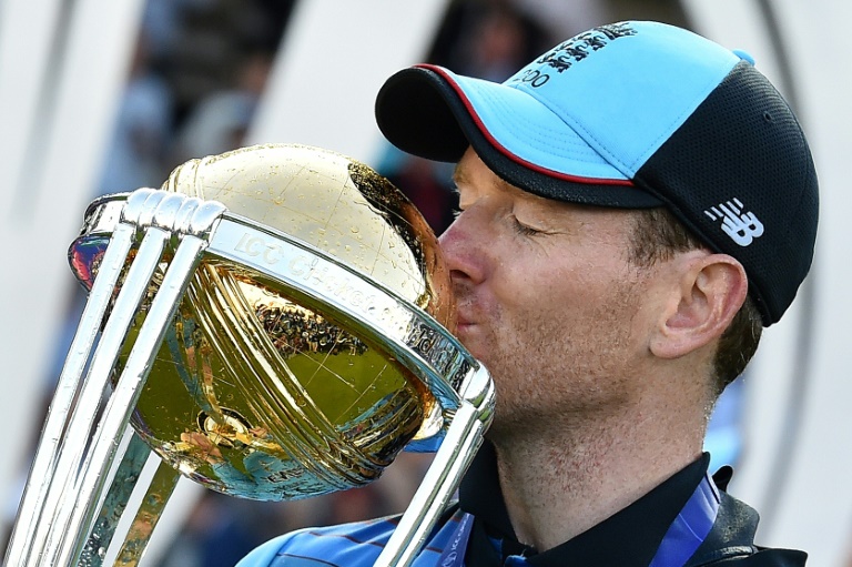 England captain Eoin Morgan kisses the World Cup trophy after his side's triumph at Lord's in 2019 | AFP