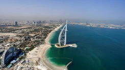 A view of the Burj al-Arab hotel in the Gulf emirate of Dubai, with the man-made Palm Jumeirah archipelago seen in the background | AFP