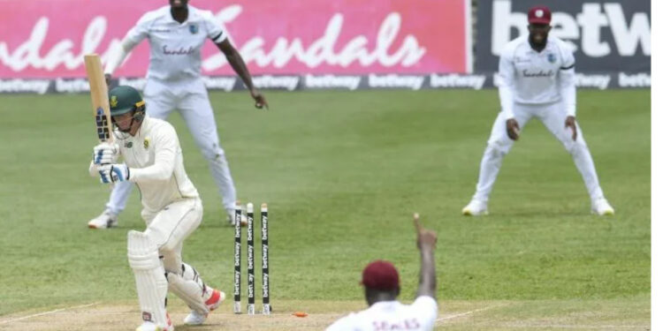That's out: Rassie van der Dussen is bowled by Kemar Roach | AFP