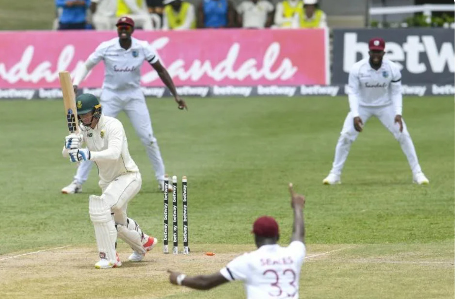 That's out: Rassie van der Dussen is bowled by Kemar Roach | AFP