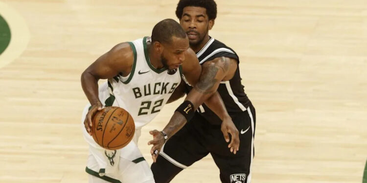 Kyrie Irving guarding Khris Middleton