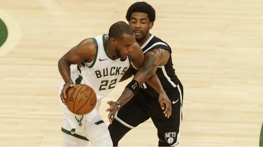 Kyrie Irving guarding Khris Middleton
