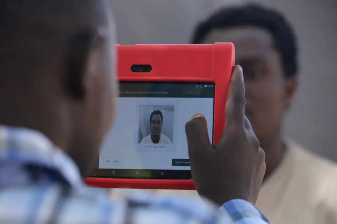 An officer of the National Integrated Identity Management system collects data for Mr Charles Chepkwony’s digital ID in 2019 in Baringo, Kenya. Photo by Billy Mutai/SOPA | Images/LightRocket via Getty Images