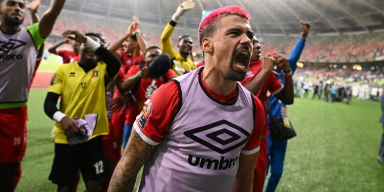 Man of the match Iban Salvador Edu leads the Equatorial Guinea celebrations after they stunned Algeria | AFP