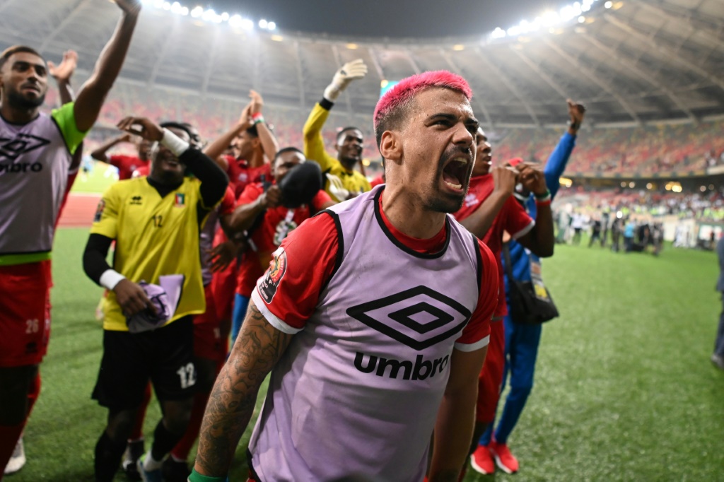 Man of the match Iban Salvador Edu leads the Equatorial Guinea celebrations after they stunned Algeria | AFP