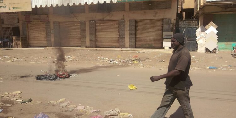 Shops are seen closed in Khartoum's Sajane Market on January 18, 2022, as part of a civil disobedience campaign following the killing of seven anti-coup demonstrators, including a merchant from the market | AFP