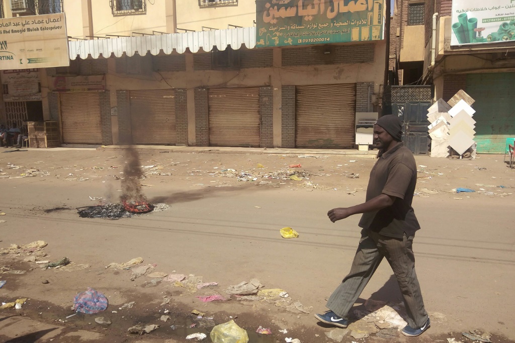 Shops are seen closed in Khartoum's Sajane Market on January 18, 2022, as part of a civil disobedience campaign following the killing of seven anti-coup demonstrators, including a merchant from the market | AFP