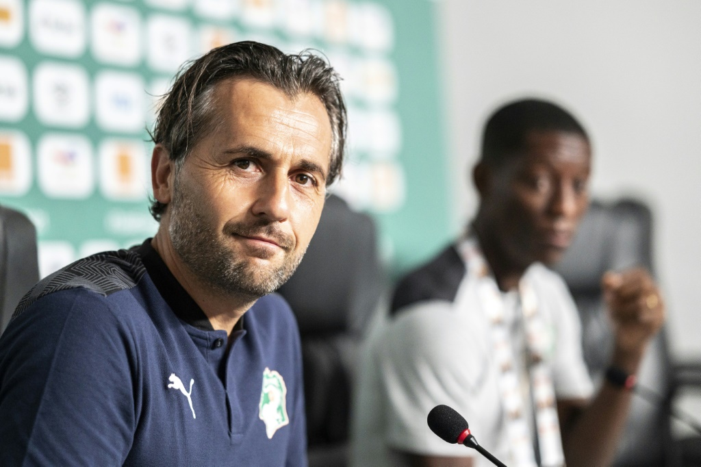 Ivory Coast coach Patrice Beaumelle with Max-Alain Gradel at a team press conference in Douala on Wednesday | AFP