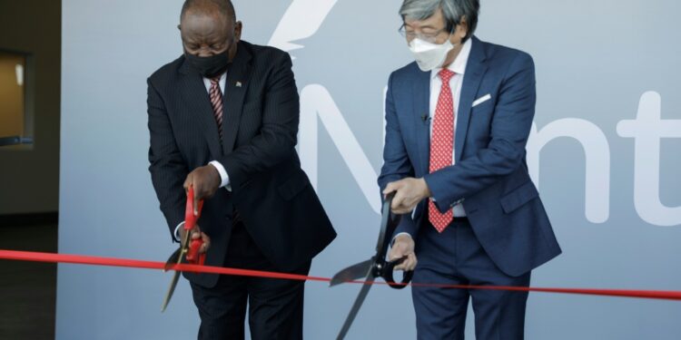 Scissor ceremony: President Cyril Ramaphosa, left, joins biotech tycoon Patrick Soon-Shiong in launching the vaccine hub | AFP