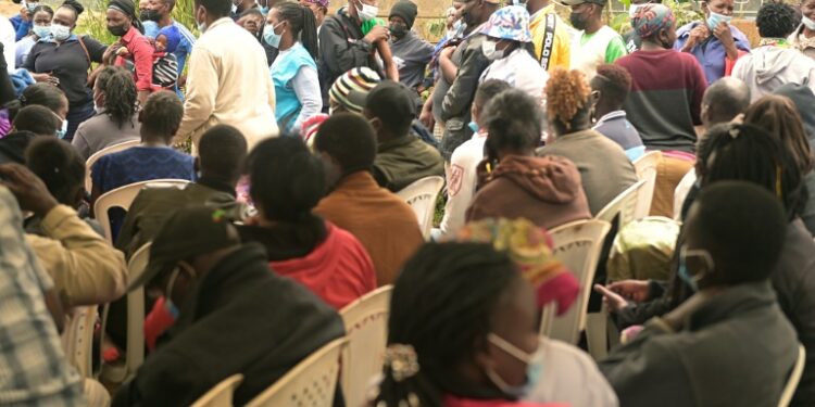 People wait to be vaccinated against Covid-19 at Ngando informal settlement in Nairobi during a mass vaccination | AFP