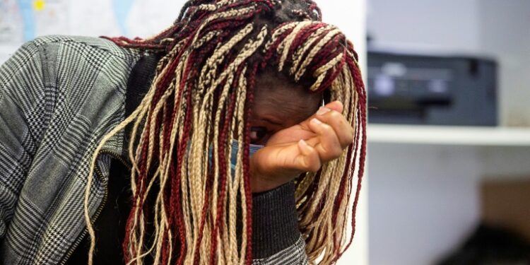 Cameroonian Merline, 30, cries recalling her four-year ordeal to reach France | AFP