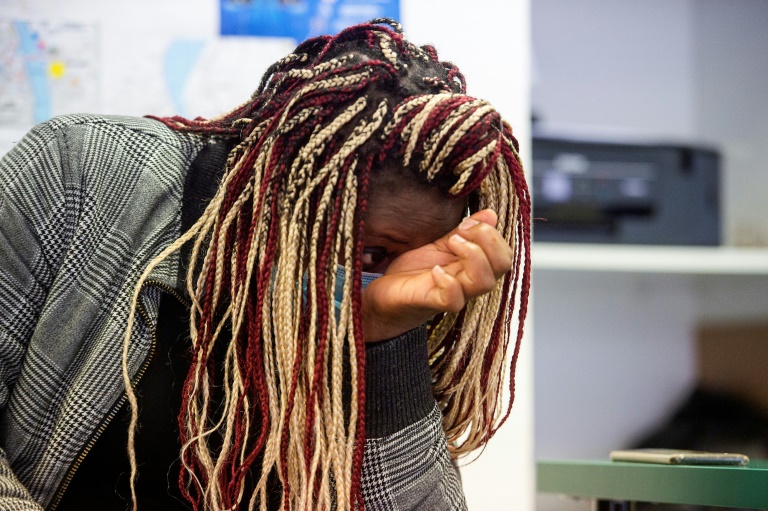 Cameroonian Merline, 30, cries recalling her four-year ordeal to reach France | AFP