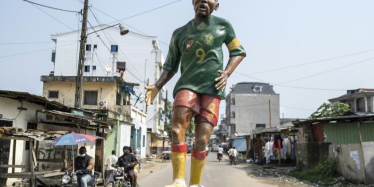 A statue of Samuel Eto'o in the green, yellow and red of Cameroon stands in the New Bell neighborhood of Douala where he grew up | AFP