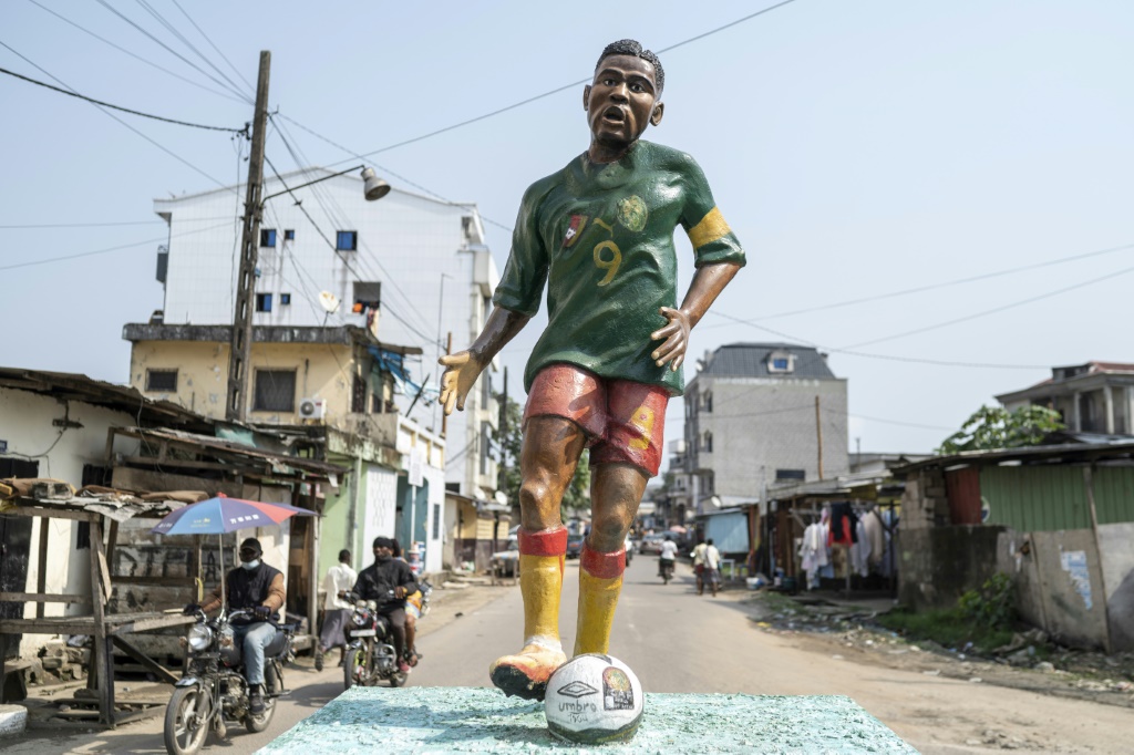 A statue of Samuel Eto'o in the green, yellow and red of Cameroon stands in the New Bell neighborhood of Douala where he grew up | AFP