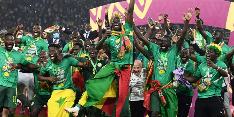 Senegal celebrate with the trophy after winning their first Africa Cup of Nations title | AFP