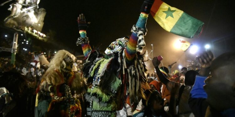 Senegal supporters celebrate in Dakar after the Lions beat Egypt in the Africa Cup of Nations final | AFP