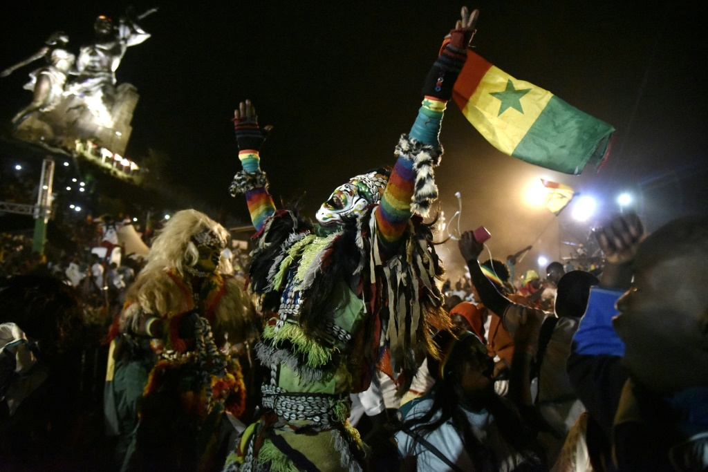 Senegal supporters celebrate in Dakar after the Lions beat Egypt in the Africa Cup of Nations final | AFP