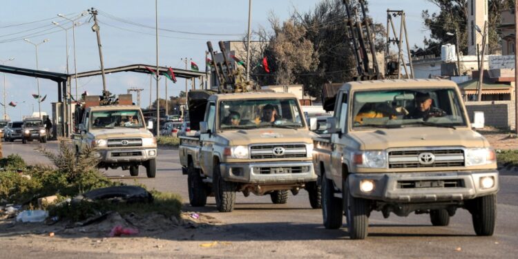 Vehicles of military brigades loyal to the Libyan unity government headed by Abdulhamid Dbeibah arrive from neighboring towns to the capital Tripoli | AFP