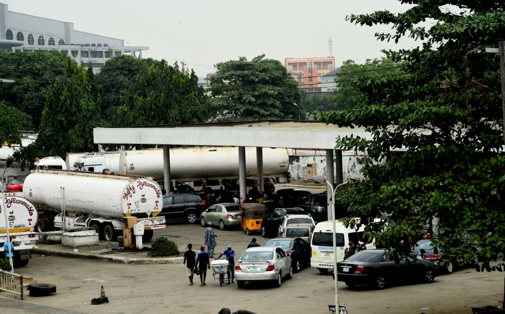 Motorists formed lines at filling stations in Nigeria as fuel shortages cause disruption | AFP