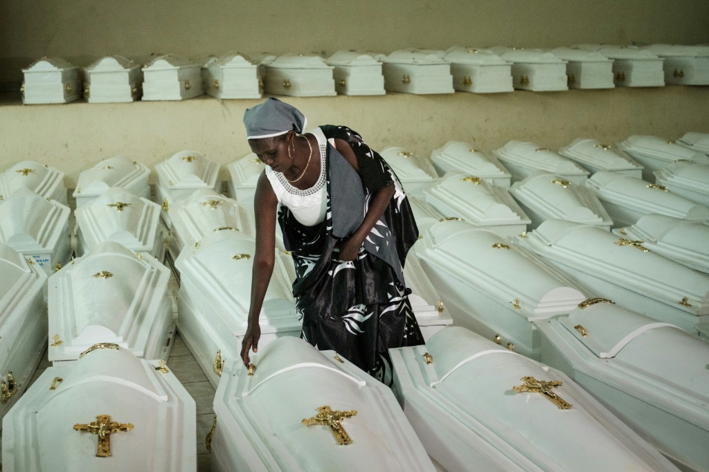 A survivor of the genocide, pictured in Kigali before a mass burial of victims in 2019 | AFP