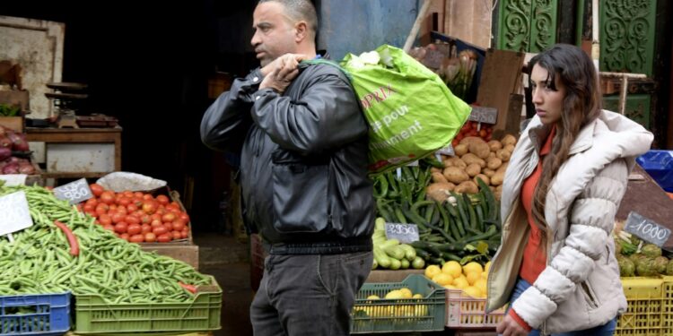 Tunisians shop at Halfaouine market near central Tunis on February 15, 2022. The Tunisian economy is plagued by recession, inflation and high unemployment | AFP