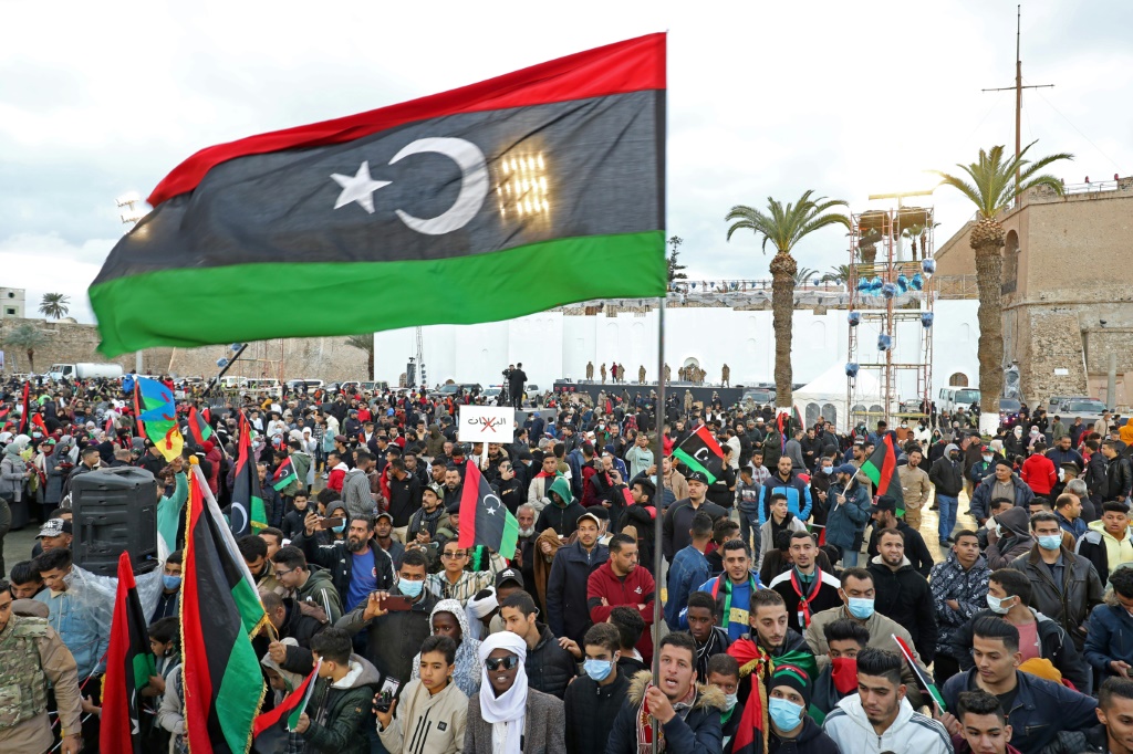 Libyans celebrate in the capital Tripoli the 11th anniversary of the uprising that ousted dictator Moamer Kadhafi amid political tensions in the North African country | AFP