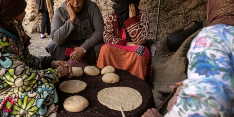 A member of a women's rights group meets with women in a remote village in Morocco, where a legal loophole has resulted in thousands of child marriages annually | AFP