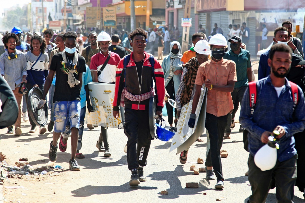 Sudanese anti-coup protesters take part in a demonstration calling for civilian rule and justice for protesters killed since last year's coup, in Diyum district of the capital Khartoum on February 7, 2022 | AFP