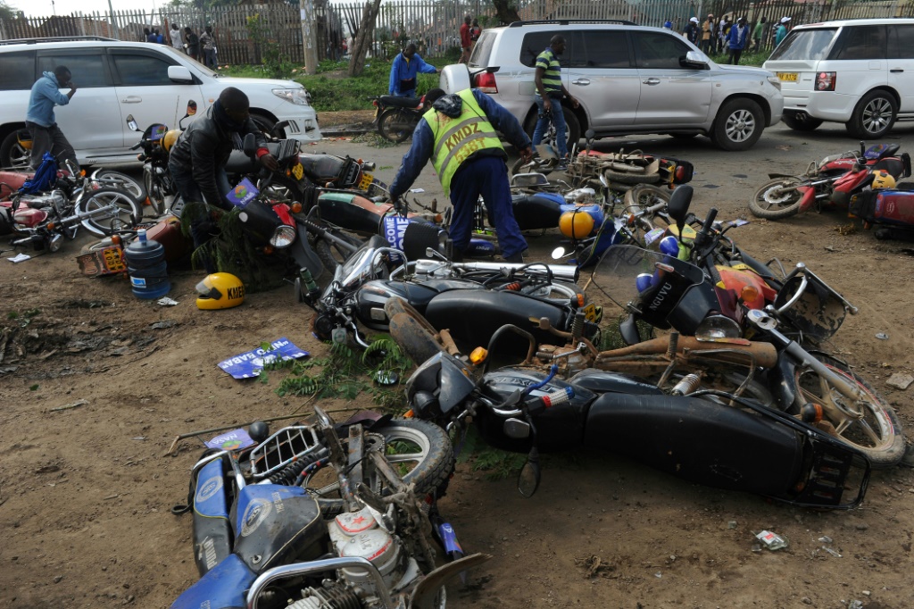 Motorcycle taxi drivers in Kenya are typically young men and are notorious for breaching the highway code | AFP