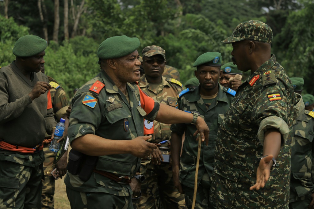 Congolese General Camille Bombele, left, and Ugandan Major General Kayanja Muhanga, at a camp in Semulki last December | AFP