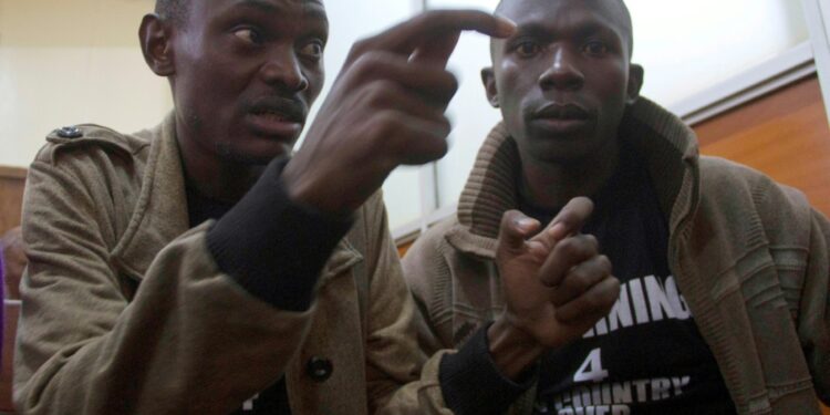 Tumuhimbise (L) was due to launch a book critical of President Yoweri Museveni on March 30 | AFP