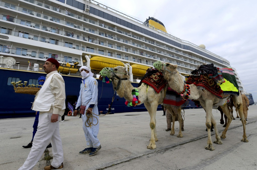 Tunisian authorities lay on camels for passengers on the first cruise ship to dock since 2019, hopeful that it signals the start of a post-Covid recovery in tourism | AFP
