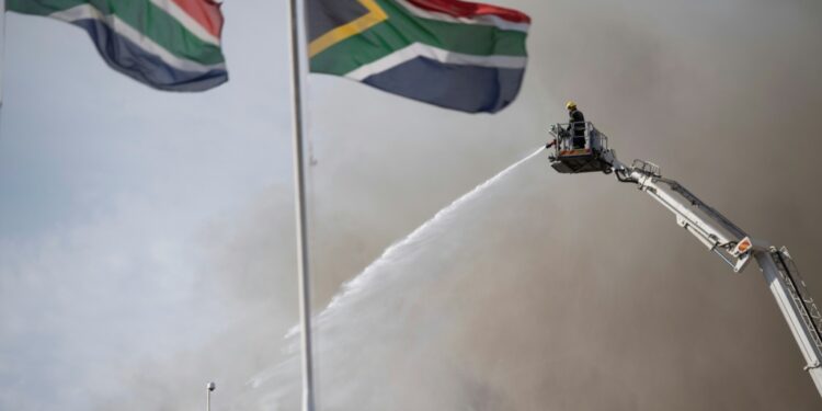 About 50,000 litres of water, enough to fill a swimming pool, still sits in the basement of the parliament | AFP