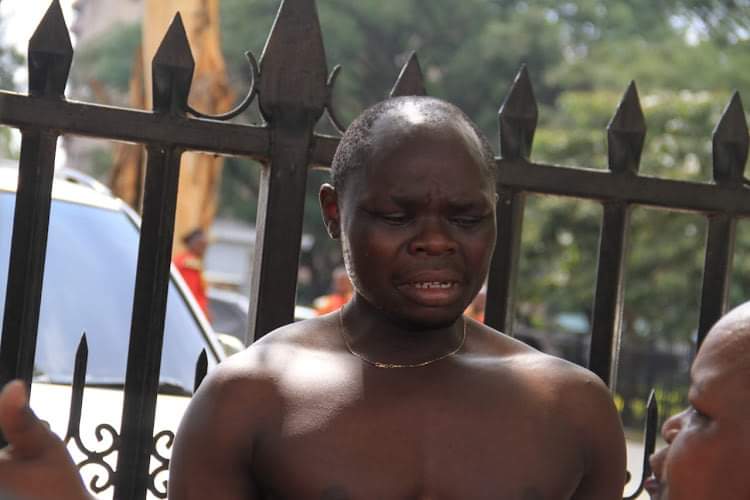 The man who claims to be retired president Mwai Kibaki's grandson at Parliament Buildings