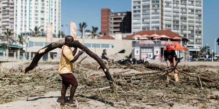 The death toll from South Africa's unprecedented floods has risen to 395 | AFP