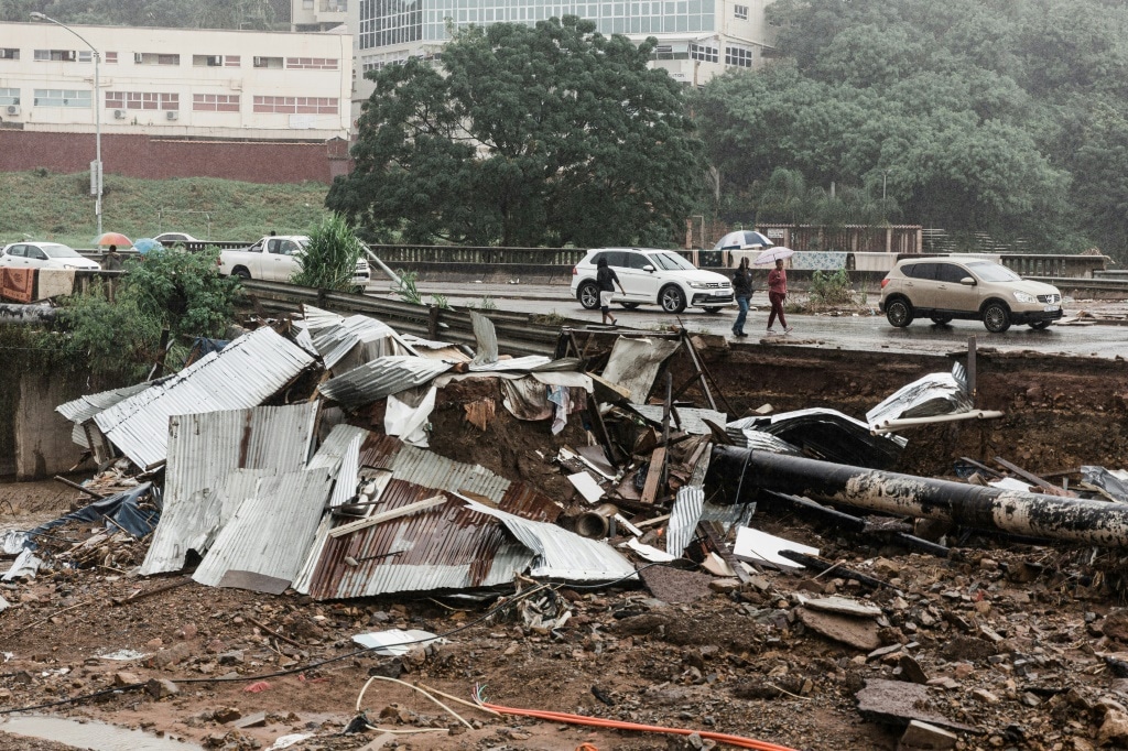 Thousands of people in shacks have lost their homes in the floods, while roads, water pipes and power lines have been wrecked | AFP