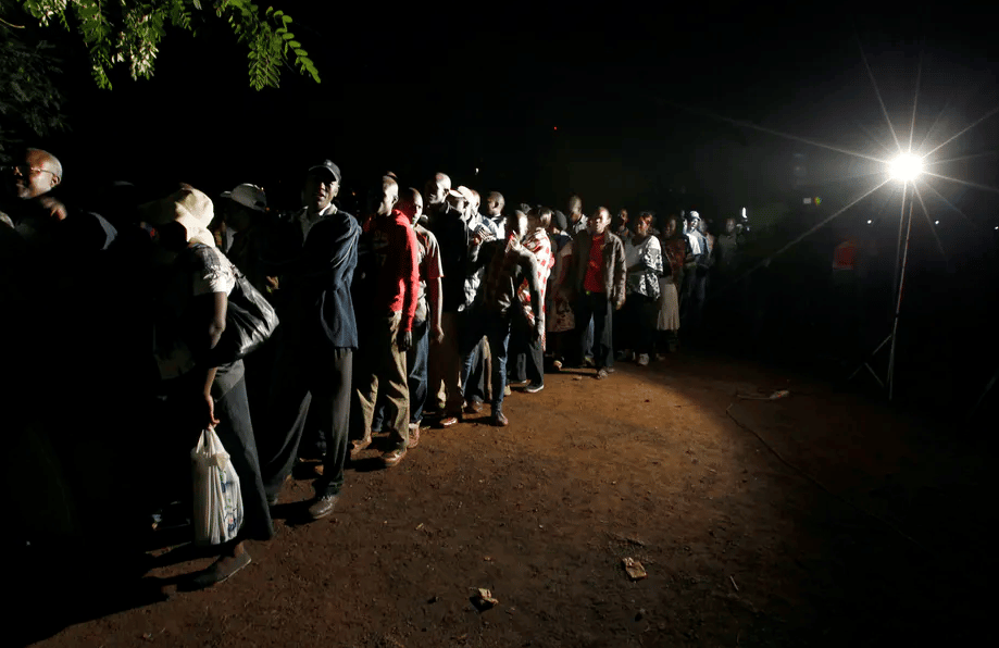 Voters queue to cast their ballots during presidential and parliamentary elections in 2013 | Reuters/Thomas Mukoya