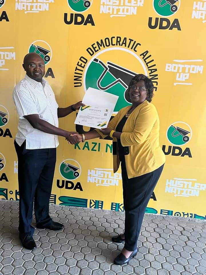 Naivasha MP Jayne Kihara receiving her UDA nomination certificate after the party repeated the nomination process by way of interviews
