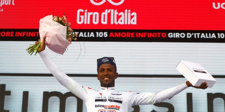 Youthful promise: Biniam Girmay celebrates after pulling on the best young rider jersey in the Giro d'Italia | AFP