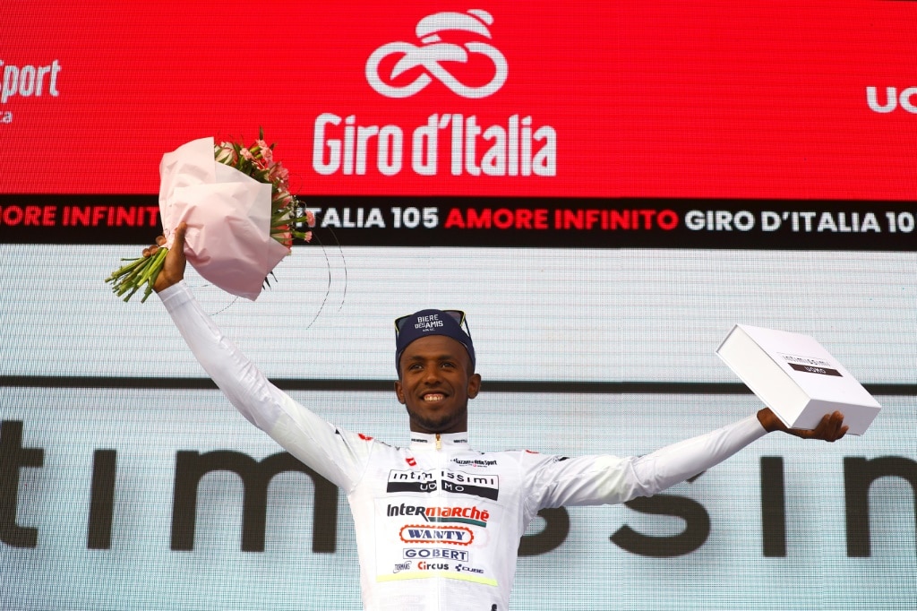 Youthful promise: Biniam Girmay celebrates after pulling on the best young rider jersey in the Giro d'Italia | AFP