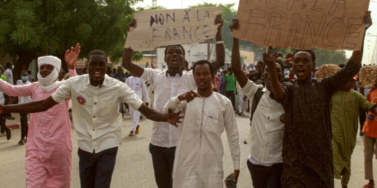 Hundreds of people marched on Saturday, and at least two French flags were burned, an AFP journalist saw | AFP